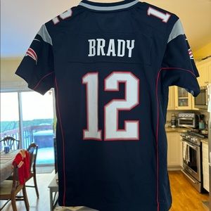 Rare official NFL New England Patriots Tom Brady #12 football jersey. Boys M